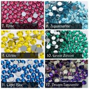 May include: Assortment of rhinestones in various colours, including rose, aquamarine, citrine, green zircon, capri blue, and dream tanzanite.