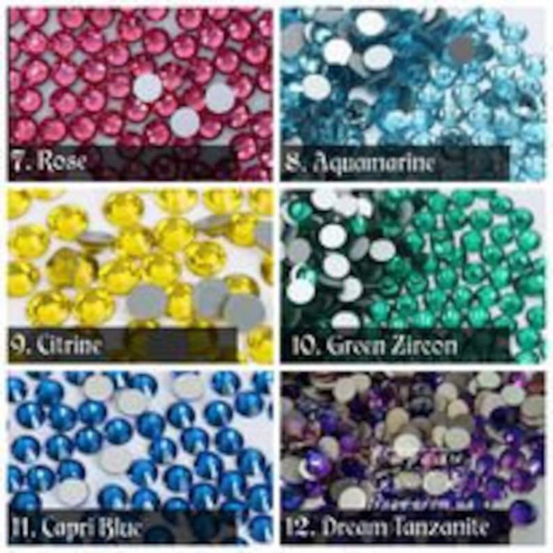 May include: Assortment of rhinestones in various colours, including rose, aquamarine, citrine, green zircon, capri blue, and dream tanzanite.