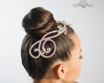 May include: A crystal hair comb with a floral design. The comb is made of metal and has a silver finish. The crystals are clear and iridescent.
