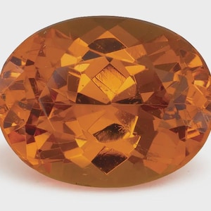May include: An oval-cut gemstone with a vibrant orange hue and a faceted surface. The stone features numerous geometric cuts that create internal reflections and depth, showcasing a translucent, warm amber color throughout the entire piece.