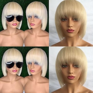 Könnte beinhalten: Vier blonde Perücken mit stumpfen Pony und einem Bob-Schnitt. Die Perücken befinden sich auf Mannequin-Köpfen mit Make-up.