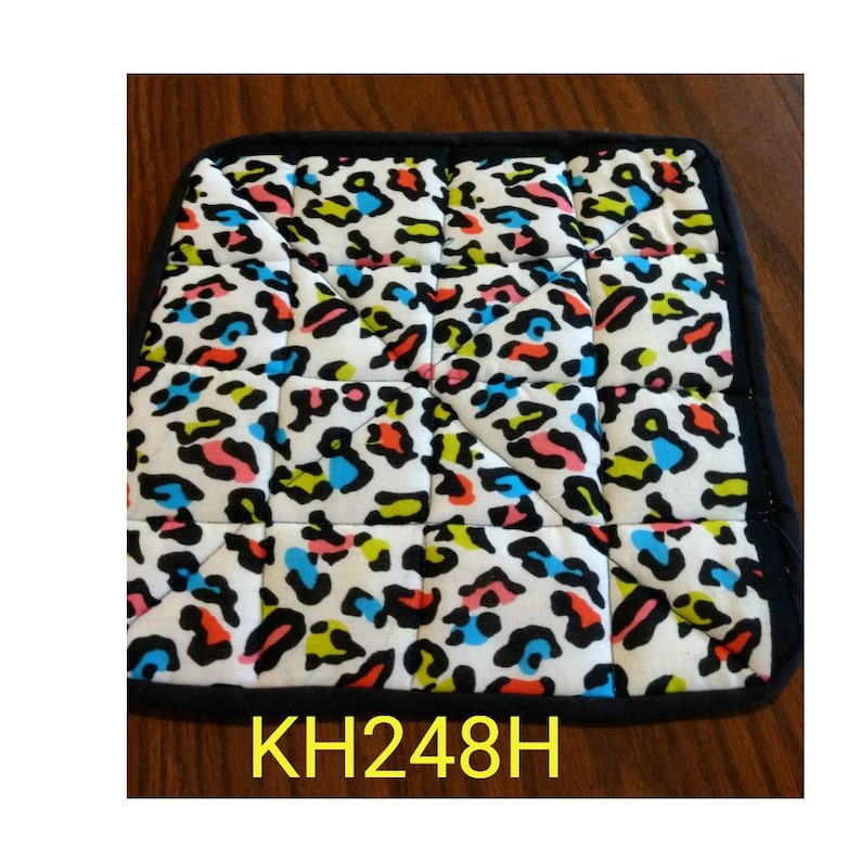 Handy in the kitchen or when serving hot dishes at the dinner table. Free Shipping Hot pads or pot holders VI