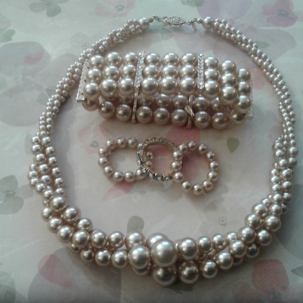 Roman Set of Triple Twisted Strand of Faux Pearls, Bracelet, and Three Rings, Champagne and Rhinestone, Signed RMN