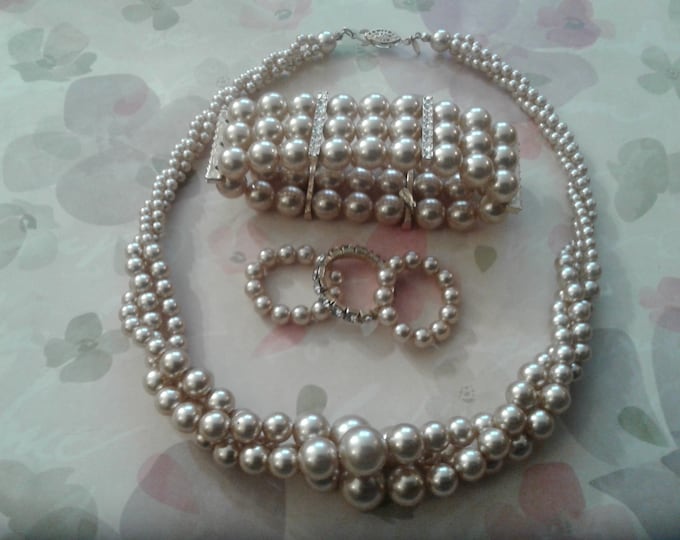 Roman Set of Triple Twisted Strand of Faux Pearls, Bracelet, and Three Rings, Champagne and Rhinestone, Signed RMN