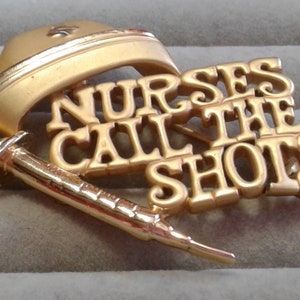 AJC Goldtone &quot;Nurses Call The Shots&quot; Pin with Cap and Hypodermic, Signed
