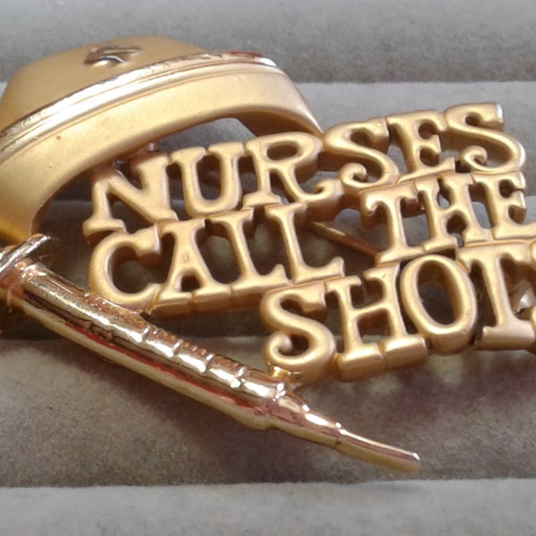 AJC Goldtone "Nurses Call The Shots" Pin with Cap and Hypodermic, Signed