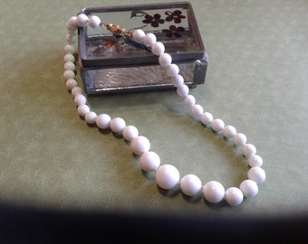 Short Strand of Knotted Graduated White Beads with Barrel Clasp