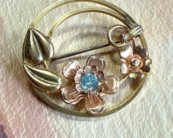 L.S.Co pink and yellow 1/20 10 K Goldfilled floral brooch with blue rhinestone