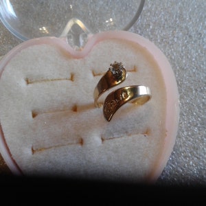 April Adjustable Simulated Birthstone Ring, Currently About a Size 6