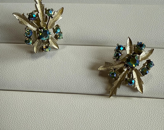 Vintage 1960s pale, gold tone and green AB rhinestone leaf clip on earrings