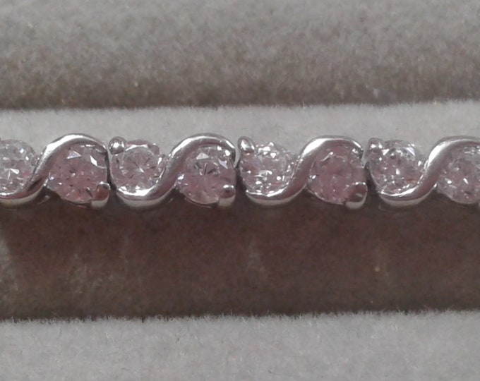 Cubic Zirconia and Silvertone Base Metal Tennis Bracelet, Safety Catch, Marked CN