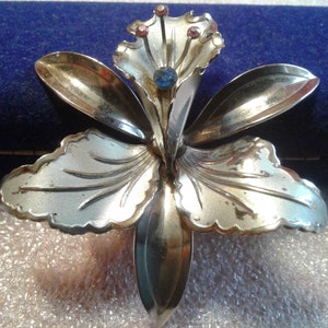 Bright and Frosted Silvertone Orchid with Pink and Blue Rhinestones Brooch