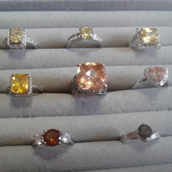 Selection of Canary, Champagne, and Brown Fancy Cubic Zirconia Silvertone Plated Solitaire Rings, Inc. RSC Covenant with Diamond Accents,