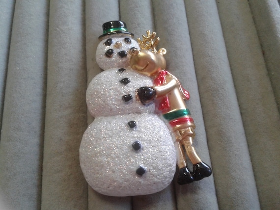 AJC Goldtone Reindeer Hugging a Snowman Pin, Sign… - image 1