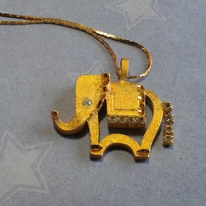Glitzy Goldtone and Rhinestone Elephant Pendant on Longer Serpentine Chain