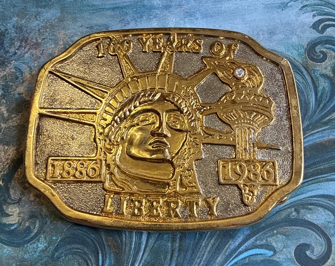 1986 Statue of Liberty commemorative belt buckle 100th anniversary with small diamond