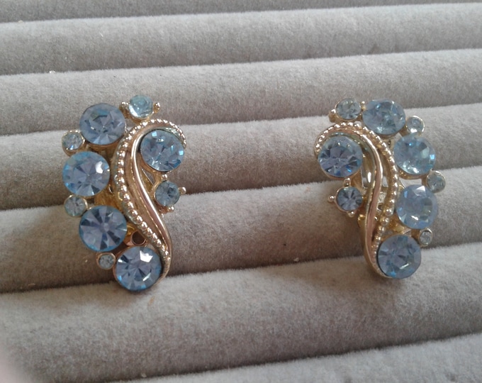 Lisner Pale Blue Rhinestone and Goldtone Swirl Clip On Earrings, Signed