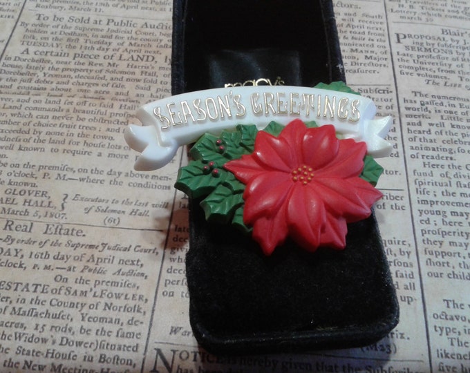 American Greetings 1980 Poinsettia with Season's Greetings Banner Plastic Novelty Pin, Signed and Dated in Roman Numerals