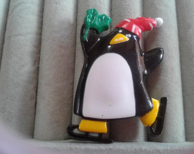 Hallmark 1989 Post Modern Skating Penguin in a Santa Hat Holding a Sprig of Holly, Signed and Dated