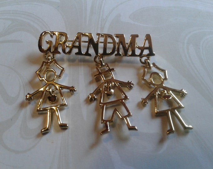 Grandma with Dangling Children Goldtone Brooch