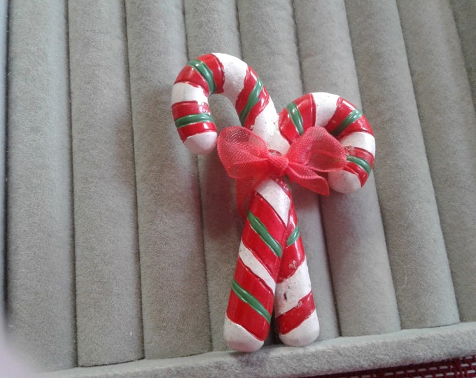 Cast Resin Crossed Candy Canes with a Red Fabric Bow