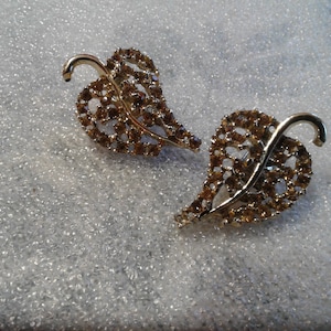 Goldtone and Champagne Rhinestone Oversized Leaf Clip On Earrings