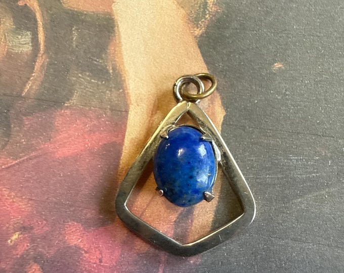 Sterling silver, small geometric pendant with oval cabochon of lapis lazuli