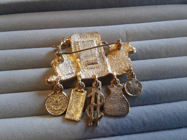 Signed and Faux Currency Rolls Royce Grill AJC Rich and Famous Matte and Shiny Goldtone Pin with Money Bag Rhinestones