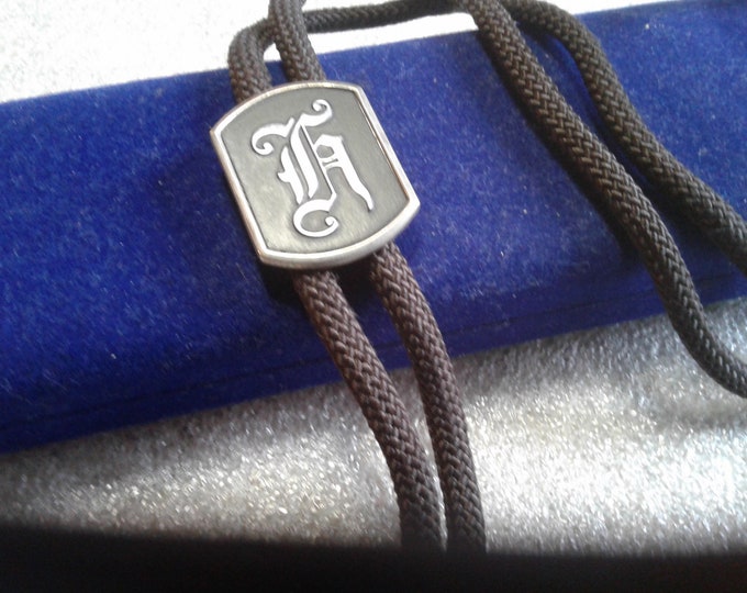 Swank Bolo Tie with "H" Initial Slide and Silvertone Tips, Signed