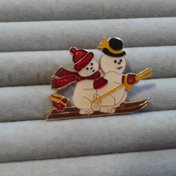 Centennia 1980 Soft Enamel Cloisonne Two Snowmen on Skis with a Little Bird Pin