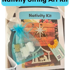 May include: A Nativity string art kit in a box with a blue and white bag of string, a wooden base with a star and a nativity scene, and a business card for Joyful Imperfections.
