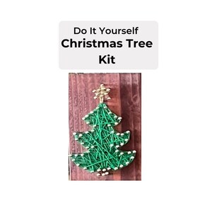 May include: A DIY Christmas tree kit featuring a green string art Christmas tree with a gold star on top. The tree is mounted on a wooden board.