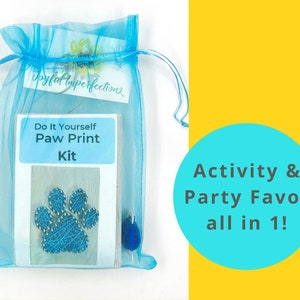 May include: A DIY Paw Print Kit in a sheer blue drawstring bag. The kit includes a blue yarn paw print design and a small blue pom-pom. Text on the kit reads "Do It Yourself Paw Print Kit". A teal circle with white text says "Activity & Party Favor all in 1!"