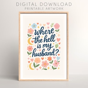 Op de afbeelding: Een ingelijste print met de tekst "Where the hell is my husband?" in marineblauwe letters. Het kunstwerk is versierd met kleurrijke bloemen, harten en halve manen. De woorden "DIGITAL DOWNLOAD PRINTABLE ARTWORK" staan bovenaan.