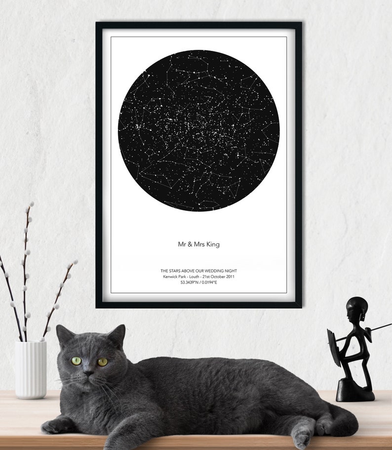 May include: A black and white star map print with the text "Mr & Mrs King" and "THE STARS ABOVE OUR WEDDING NIGHT Kenwick Park - Louth - 21st October 2011 53.3439N/00194E".