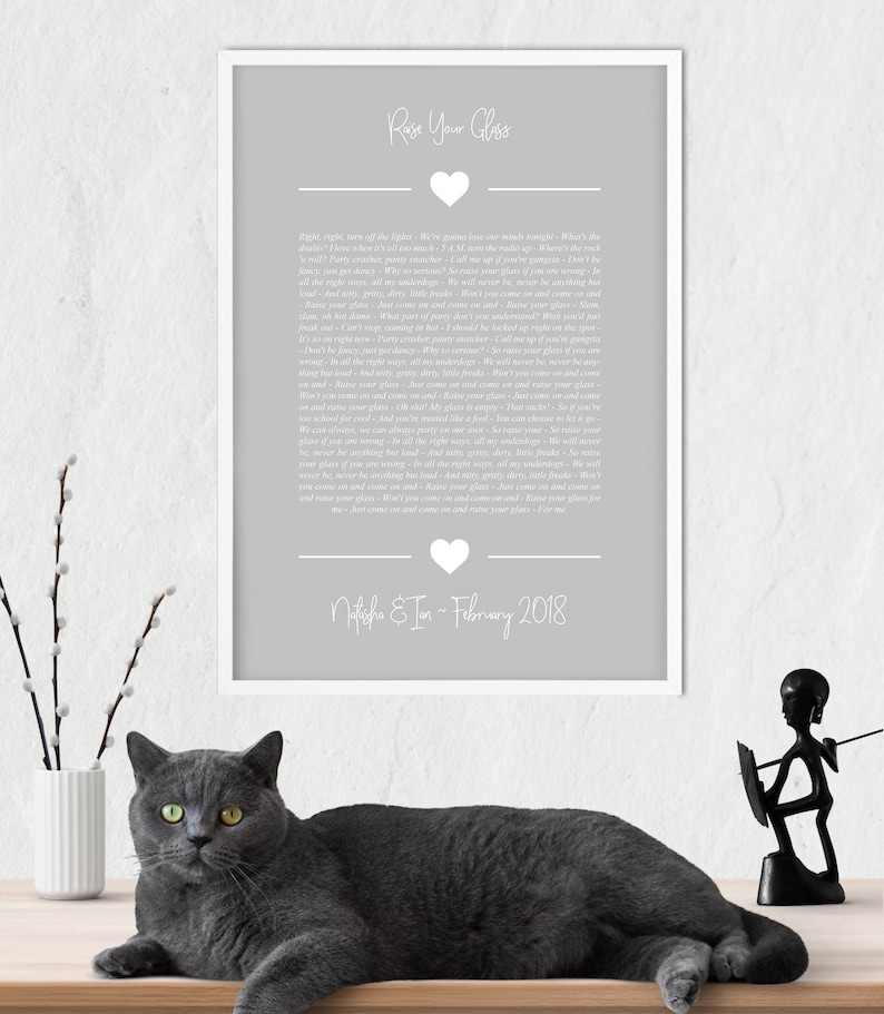 May include: A gray and white printable wedding vow template with the text "Raise Your Glass" and a heart. The text includes a wedding vow poem and the names "Natasha & Ian" and the date "February 2018".