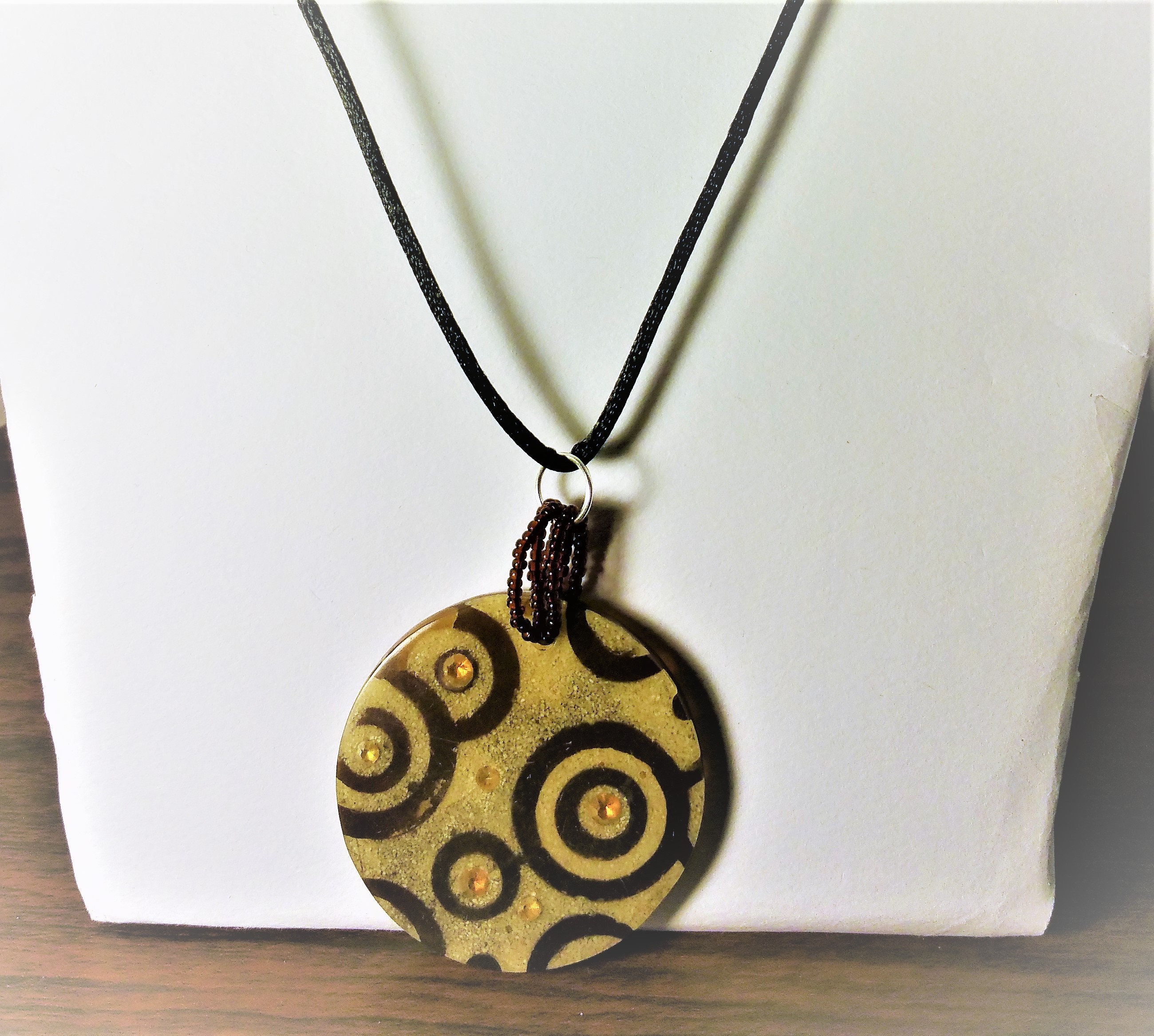 GOLD BROWN RESIN INSET CORD PENDANT NECKLACE main image 1