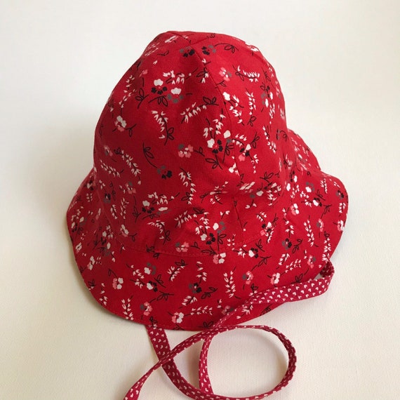 red floppy sun hat