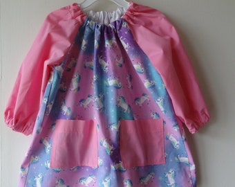 Long Sleeved Cotton Art and Craft Smock with Pockets. Unicorns on Sparkly Pink, Blue and Purple.