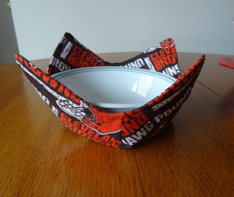 Cleveland Browns bowl cozy holding a white bowl.