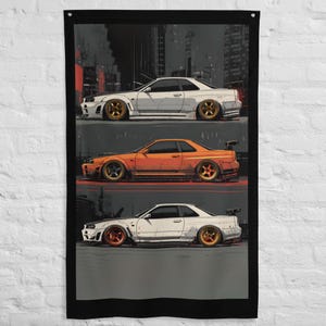 May include: Vertical wall hanging featuring three stylized illustrations of sports cars. The cars are white and orange, with gold and red rims. The background depicts a cityscape in shades of gray and red.