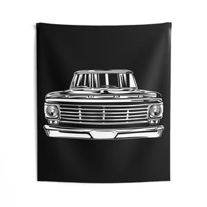 May include: Black and white illustration of a classic pickup truck, showcasing the front view. The design highlights the grille, headlights, and bumper against a solid black background. This wall tapestry is perfect for automotive enthusiasts.
