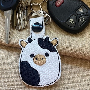 Squishy Cow Keychain: Embroidered Faux Leather Snap Tab