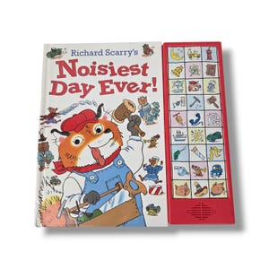 May include: Richard Scarry's Noisiest Day Ever! children's book with a white cover featuring a cartoon cat in blue overalls holding a wooden mallet and saw. Beside the book is a red plastic sound board with twenty-four colorful icons.