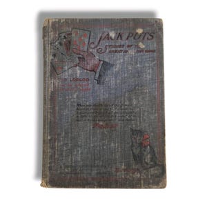May include: Vintage book titled "Jack Pots" with a blue and gray cover. The cover features an illustration of a hand holding playing cards, the word "Poker" in red, and a drawing of a cat with a red bow.