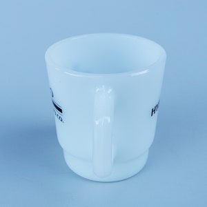 May include: White ceramic mug with a black logo that reads "Hydro Flask Co.".