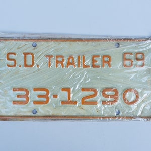 Vintage 1969 South Dakota Trailer License Plate - NOS In Sealed Plastic Sleeve - Orange Lettering