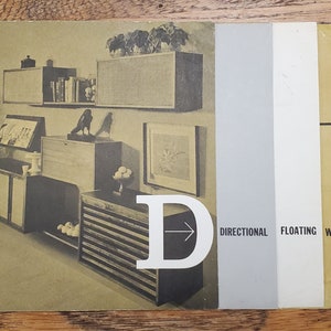 May include: A black and white image of a room with a wall unit made of wood and shelves. The wall unit is labeled "Directional Floating Wall".