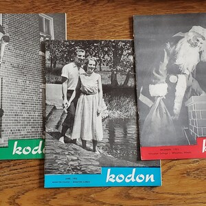 May include: A collection of five vintage magazines with the word "kodon" printed on the cover. The covers feature various designs, including a couple standing in front of a brick building, a man and woman standing in a park, a man dressed as Santa Claus, and an abstract design with pink and black shapes.