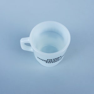 May include: White ceramic mug with black text that reads "FILTERS HYDRAULIC FITTINGS".